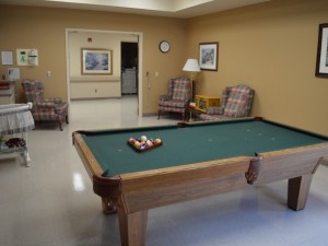 Indoor recreational area with pool table and seating