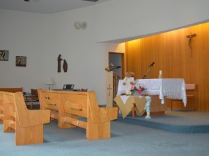 Inside of small chapel with two benches 
